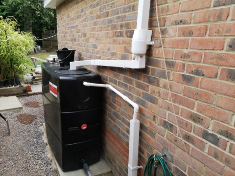 I just diverted the whole drain pipe to ensure maximum water collection, then added an overflow for excess water, I don't mind a bit of overflow onto the path, as 1 inch pvc was the biggest I could easily fit, hopefully it will suffice most of the time!